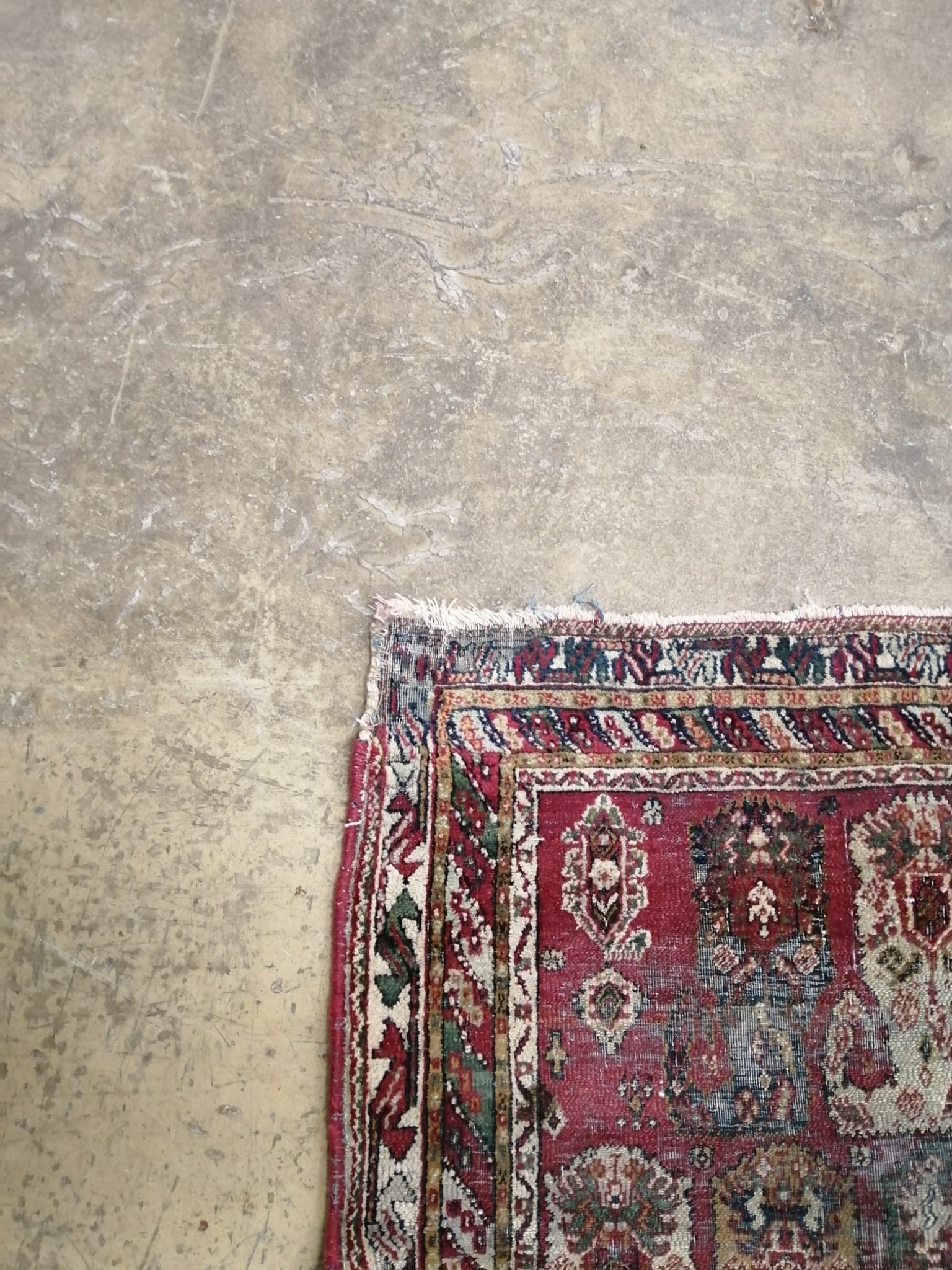 An antique Agra rug 210 x 124cm